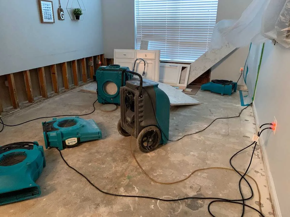 Dehumidifier in flood-cut room for Water Damage Restoration in Newton